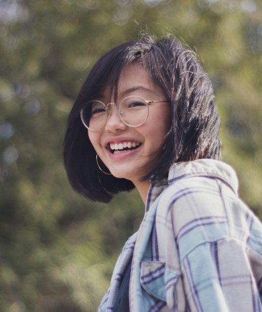Young woman smiling outdoors