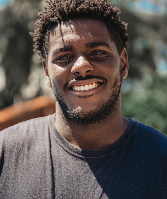 Young man smiling outdoors