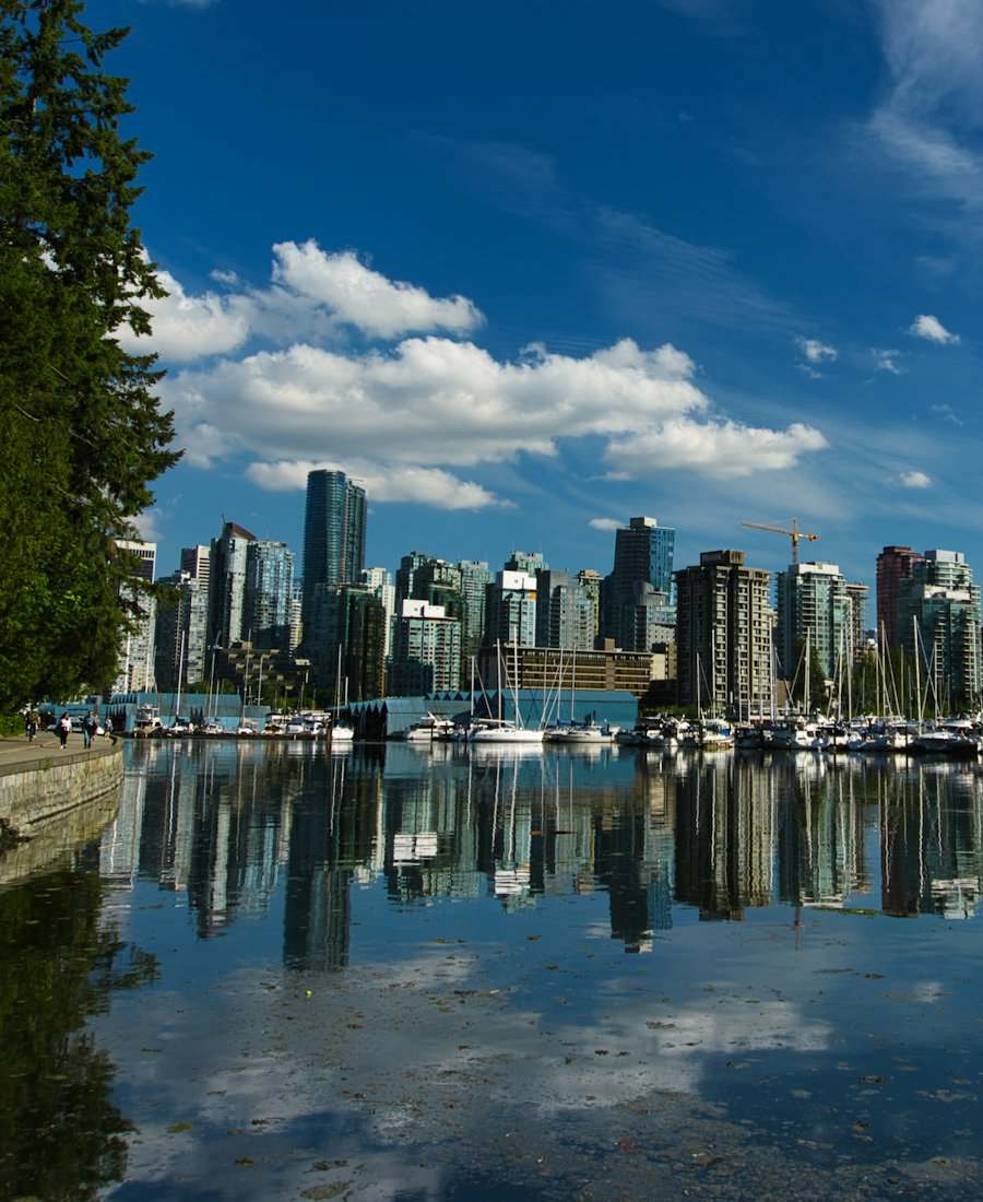 Vancouver skyline reflected in the water from the Stanley Park seawall